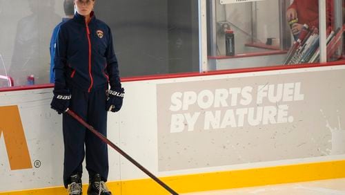 Christine Bumstead, a performance coach for the Saskatoon Blades in Canada's Western Hockey League, watches as Florida Panthers players do drills during NHL hockey training camp, Thursday, Sept. 19, 2024, in Fort Lauderdale, Fla. Bumstead is working as part of the Panthers coaching staff during training camp. (AP Photo/Lynne Sladky)