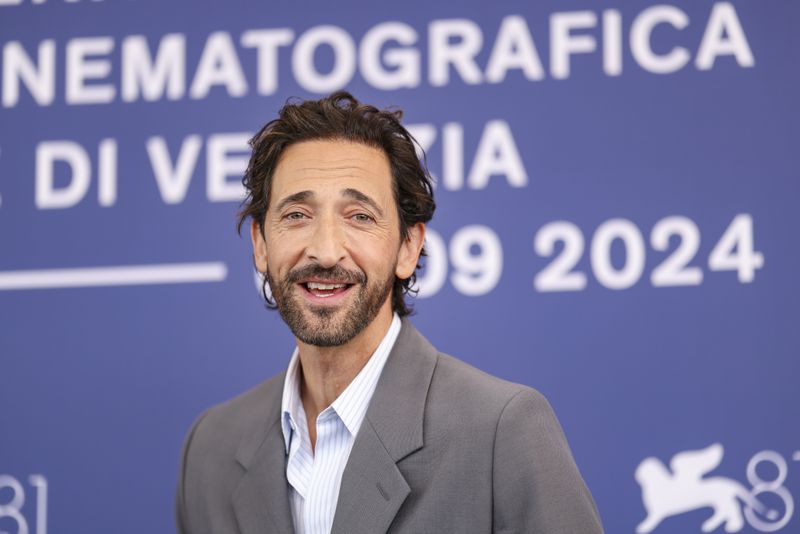 Adrien Brody poses for photographers at the photo call for the film 'The Brutalist' during the 81st edition of the Venice Film Festival in Venice, Italy, on Sunday, Sept. 1, 2024. (Photo by Vianney Le Caer/Invision/AP)