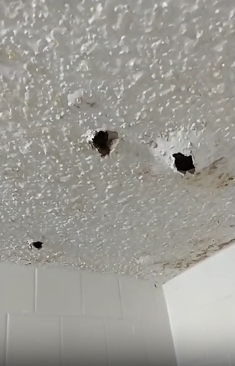 A water leak above a renter's bathroom ceiling at CIelo at 325 has created yawning holes.