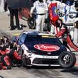 Christopher Bell (20) stops on pit road during a NASCAR Cup Series auto race at Kansas Speedway in Kansas City, Kan., Sunday, Sept. 29, 2024. (AP Photo/Colin E. Braley)