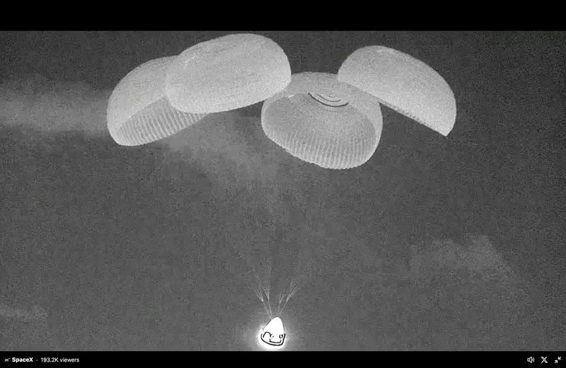 This black and white, thermal image made from SpaceX video shows its capsule, center bottom, carrying tech entrepreneur Jared Isaacman with his crew minutes before it reached the Gulf of Mexico near Florida's Dry Tortugas early Sunday, Sept. 15, 2024. (SpaceX via AP)