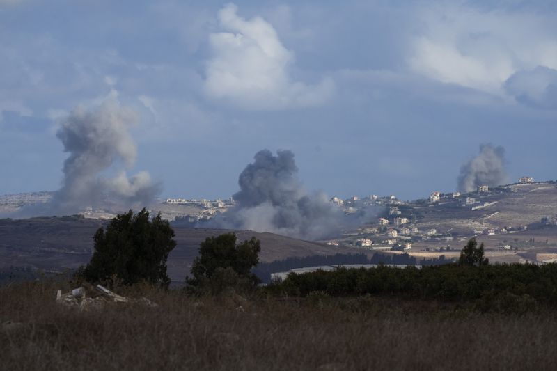 Smoke rises following Israeli bombardment in southern Lebanon as seen from northern Israel, Wednesday, Oct. 2, 2024. (AP Photo/Baz Ratner)