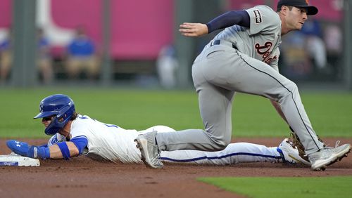 Kansas City Royals' Bobby Witt Jr. beats the tag by Detroit Tigers second baseman Colt Keith to steal second during the first inning of a baseball game Tuesday, Sept. 17, 2024, in Kansas City, Mo. (AP Photo/Charlie Riedel)