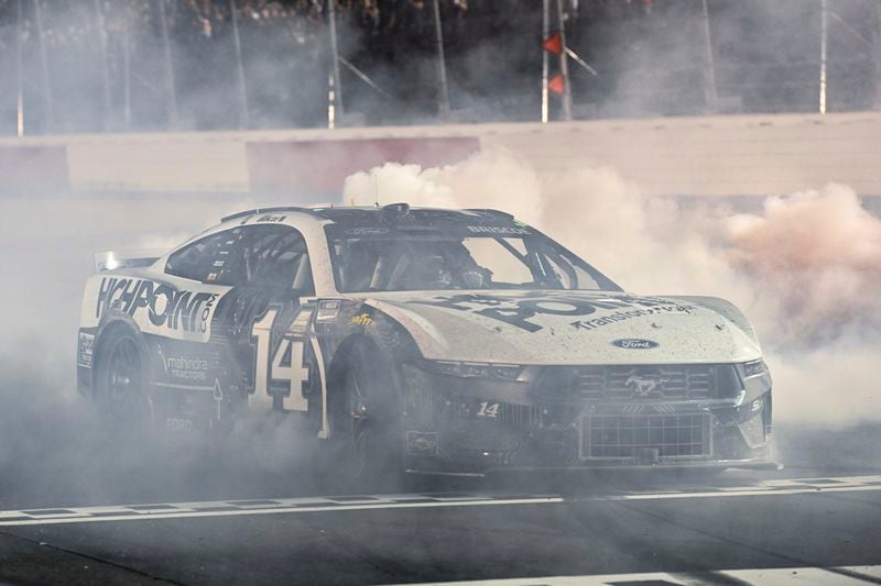 Chase Briscoe does a burnout after winning a NASCAR Cup Series auto race at Darlington Raceway, Sunday, Sept. 1, 2024, in Darlington, S.C. (AP Photo/Matt Kelley)