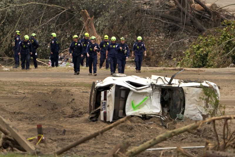 Personnel from Urban Search and Rescue Utah Task Force 1 work in the aftermath of Hurricane Helene, Friday, Oct. 4, 2024, in Erwin, Tenn. (AP Photo/Jeff Roberson)