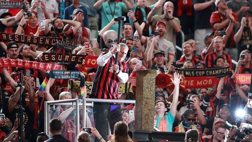 The fans cheer Atlanta United owner Arthur Blank as he hammers the golden spike to begin the game against Orlando City in a MLS soccer match on Sunday, May 12, 2019, in Atlanta. Blank also owns the Atlanta Falcons. Curtis Compton/ccompton@ajc.com