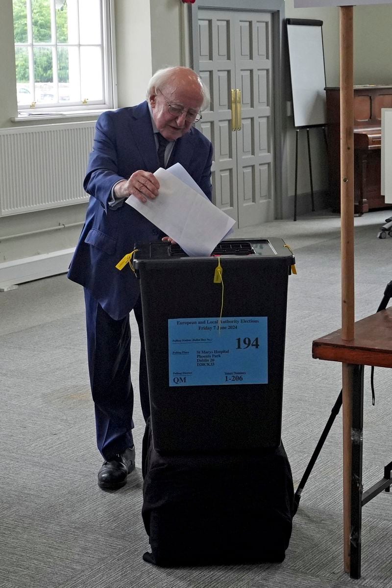President of Republic of Ireland Michael D Higgins casts his vote in the local and European elections at St Mary's Hospital in Phoenix Park, Dublin, Ireland, Friday June 7, 2024. (Niall Carson/PA via AP)