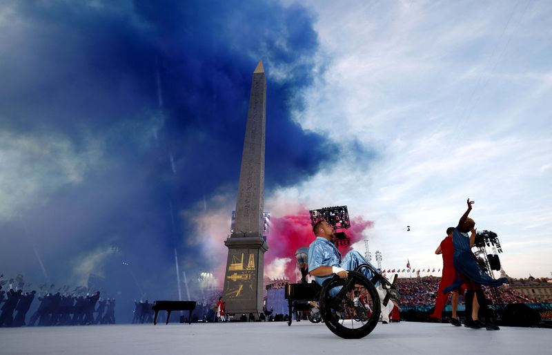 Artists perform during the Opening Ceremony for the 2024 Paralympics, Wednesday, Aug. 28, 2024, in Paris, France. (Gonzalo Fuentes/Pool Photo via AP)