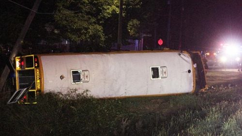 A Rome City Schools bus lies on its side off of Ga. 101 in Polk County after it was involved in a wreck while carrying Rome High School football players back from a scrimmage at Rockmart High School late Thursday night, Aug. 8. (Photo Courtesy of Jeremy Stewart)