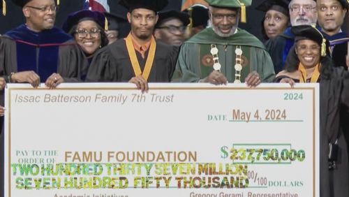 FILE - This image made from a video provided by WCTV shows Gregory Gerami, third from left, and Florida A&M University president Larry Robinson, posing with a ceremonial check, May 4, 2024, in Tallahassee, Fla. (WCTV via AP, File)