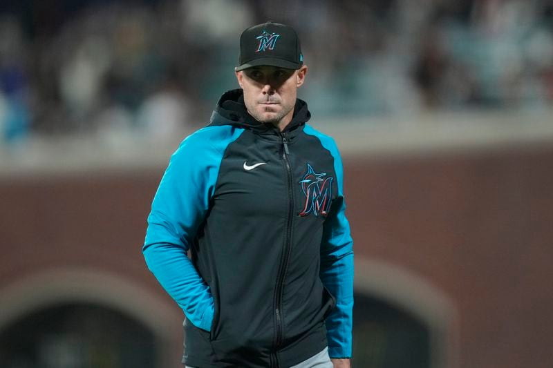 Miami Marlins manager Skip Schumaker walks off the field during the third inning of a baseball game against the San Francisco Giants= in San Francisco, Friday, Aug. 30, 2024. (AP Photo/Jeff Chiu)