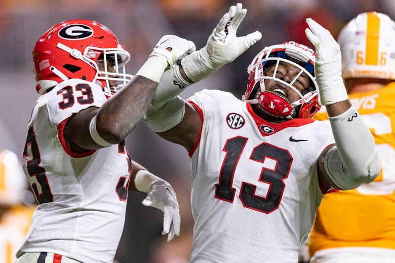 FILE - Georgia defensive lineman Mykel Williams (13) and linebacker C.J. Allen (33) react to a sack on Tennessee quarterback Joe Milton III (7) during the second half of an NCAA college football game Saturday, Nov. 18, 2023, in Knoxville, Tenn. (AP Photo/Wade Payne, File)