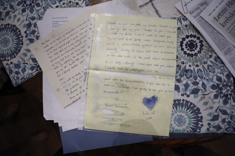 Dale Tingle saved the letters Kevin Krüger and his family wrote from their homes in Germany to thank her for the stem cell donation that saved Krüger's life. He has visited Tingle's family three times at her home in Watkinsville, considering them his new family. (Miguel Martinez/AJC)