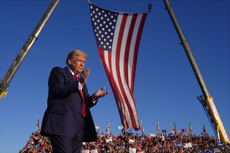 Republican presidential nominee former President Donald Trump arrives at a campaign rally at the Butler Farm Show, Saturday, Oct. 5, 2024, in Butler, Pa. (AP Photo/Evan Vucci)