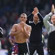 Liverpool's manager Arne Slot, centre right, celebrates with players after the English Premier League soccer match between Crystal Palace and Liverpool at Selhurst Park in London, Saturday, Oct. 5, 2024.(AP Photo/Ian Walton)