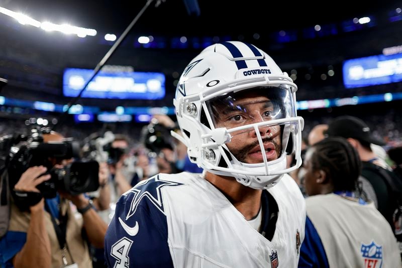 Dallas Cowboys quarterback Dak Prescott (4) walks off the field after playing against the New York Giants in an NFL football game, Thursday, Sept. 26, 2024, in East Rutherford, N.J. (AP Photo/Adam Hunger)