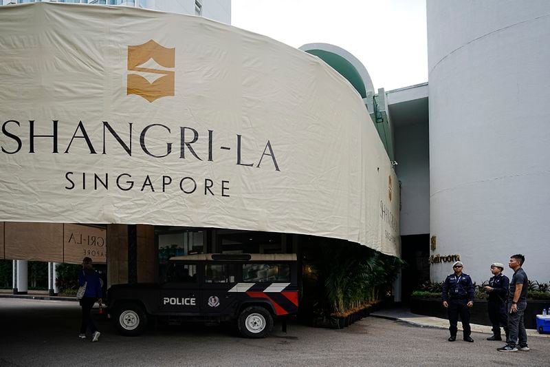 Gurkha police officers guard near the entrance of the Shangri-La Hotel, the venue for the 21th International Institute for Strategic Studies (IISS) Shangri-La Dialogue, Asia's annual defense and security forum, in Singapore, Friday, May 31, 2024. (AP Photo/Vincent Thian)