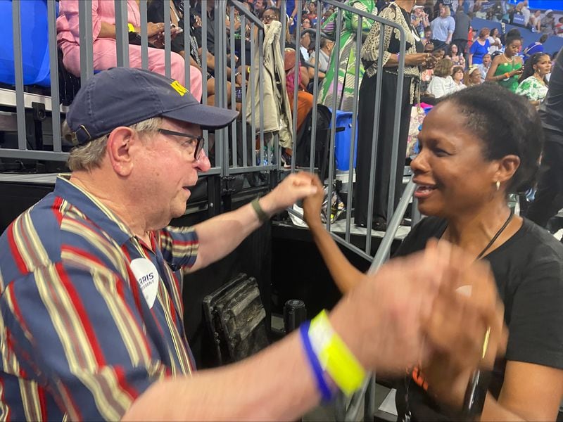 Jim Powell, a 75-year-old from Hiawassee  and a Democratic delegate, danced in the stands with Dianne Inniss of Atlanta. The two had only just met at the Georgia State University convocation center for Kamala Harris' presidential campaign rally on Tuesday, July 30, 2024. (Photo: Vanessa McCray / AJC)