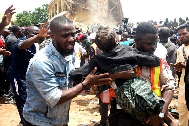 A student is rescued from the rubble of a collapsed two-storey building in Jos, Nigeria, Friday, July, 12, 2024. At least 12 students have been killed after a school building collapsed and trapped them in northern Nigeria, authorities said on Friday. (AP Photos)