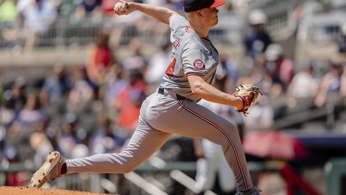 Washington Nationals pitcher DJ Herz throws in the third inning of a baseball game against the Atlanta Braves, Sunday, Aug. 25, 2024, in Atlanta. (AP Photo/Jason Allen)