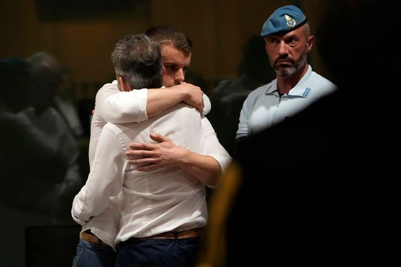 Gabriel Natale Hjorth is hugged by a relative after the reading of the judgment at the end of a hearing for the appeals trial in which he is facing murder charges for killing Italian Carabinieri paramilitary police officer Mario Cerciello Rega, in Rome, Wednesday, July 3, 2024. (AP Photo/Alessandra Tarantino)