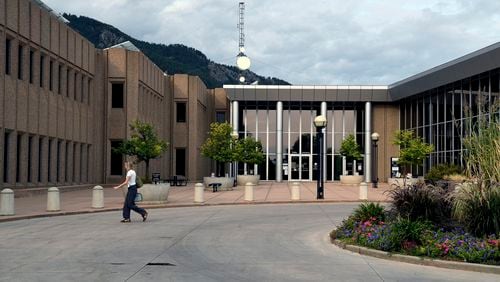 A woman walks in front of the Boulder County Justice Center in Boulder, Colo., on Thursday, Sept. 5, 2024. (AP Photo/Thomas Peipert)