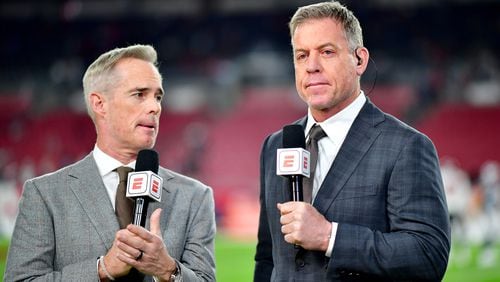 Joe Buck and Troy Aikman look on prior to a game between the Dallas Cowboys and Tampa Bay Buccaneers in the NFC Wild Card playoff game at Raymond James Stadium on Jan. 16, 2023, in Tampa, Florida. (Julio Aguilar/Getty Images/TNS)