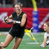 North Oconee wide receiver Grace Maddox (32) has her flag pulled by SE Bulloch defensive back Ava King (10) during the Girl’s Flag Football A-4A GHSA State Championship game at Mercedes-Benz Stadium, Monday, December. 11, 2023, in Atlanta. SE Bulloch won 14-0. (Jason Getz / Jason.Getz@ajc.com)