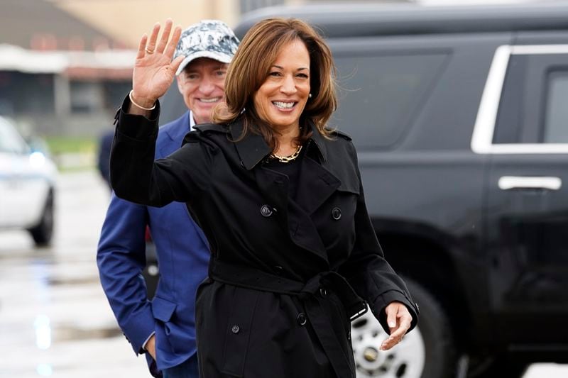 Democratic presidential nominee Vice President Kamala Harris smiles next to Sen. Mark Kelly, D-Ariz., as she departs for the U.S.-Mexico border from Joint Base Andrews, Md., Friday, Sept. 27, 2024. (Kevin Lamarque/Pool via AP)