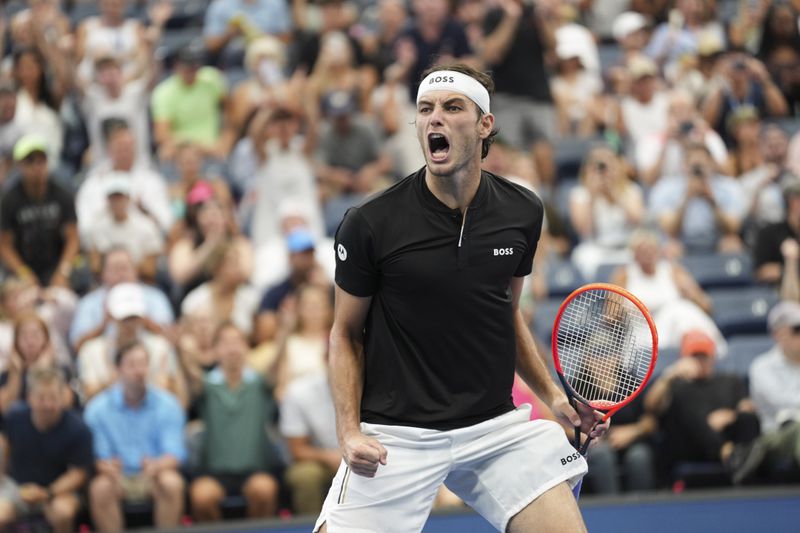 Taylor Fritz, of the United States, reacts after defeating Casper Ruud, of Norway, during the fourth round of the U.S. Open tennis championships, Sunday, Sept. 1, in New York. 2024. (AP Photo/Eduardo Munoz Alvarez)