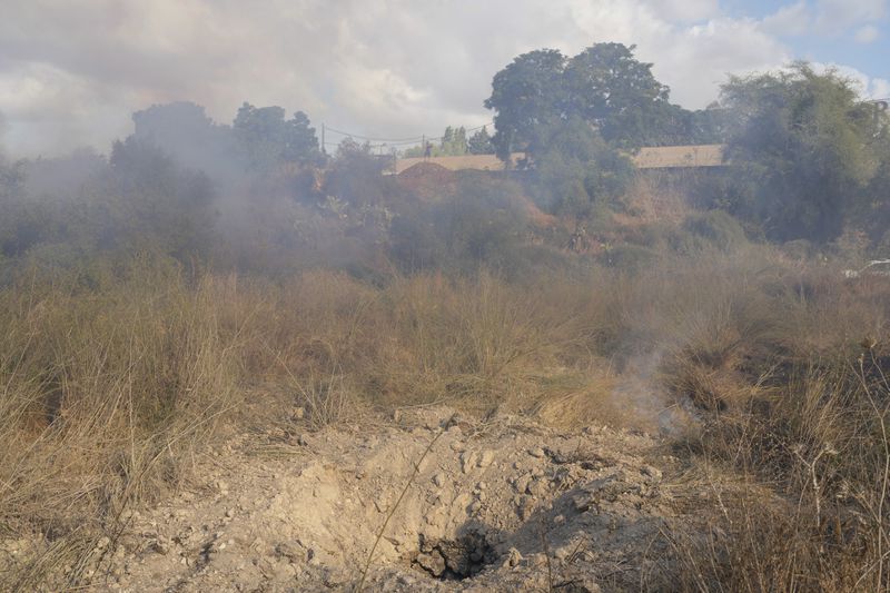 A crater is seen after the military fired interceptors at what the Israeli army says is a missile launched from Yemen that landed in central Israel on Sunday, Sept. 15, 2024. (AP Photo/Ohad Zwigenberg)