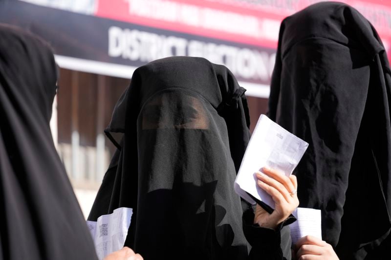 Muslim women voter queue up to cast their vote at a polling booth during the first phase of the Jammu and Kashmir assembly election, in Kishtwar, India, Wednesday, Sept. 18, 2024. (AP Photo/Channi Anand)