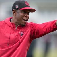 Atlanta Falcons coach Raheem Morris watches players run drills during an NFL football mini training camp practice on Tuesday, May 14, 2024, in Flowery Branch, Ga. (AP Photo/Brynn Anderson)