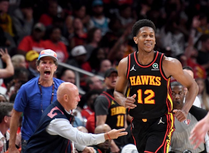 Hawks forward De'Andre Hunter (12) reacts after scoring during the second half in the NBA play-in tournament at State Farm Arena on Wednesday, April 13, 2022. (Hyosub Shin / Hyosub.Shin@ajc.com)