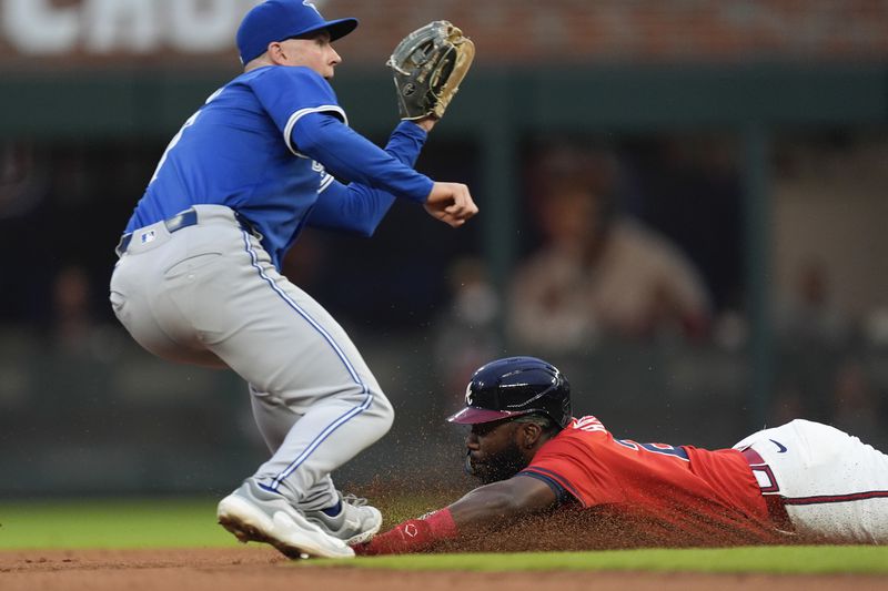 Atlanta Braves' Michael Harris II attempts to steal second base before being tagged out by Toronto Blue Jays third base Will Wagner (7) in the second inning of a baseball game Friday Sept. 6, 2024, in Atlanta. (AP Photo/John Bazemore)