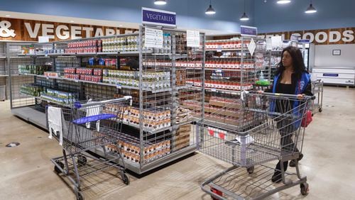 Views of the client choice food pantry at St. Vincent de Paul Society in Chamblee shown on recent Wednesday. The pantry provides free food to people in need. (Natrice Miller/ Natrice.miller@ajc.com)