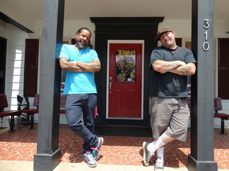 Craig Foster with the man who taught him how to ink Miami Burgess, who finished 16th on the sixth season of "Ink Master." CREDIT: Rodney Ho/rho@ajc.com