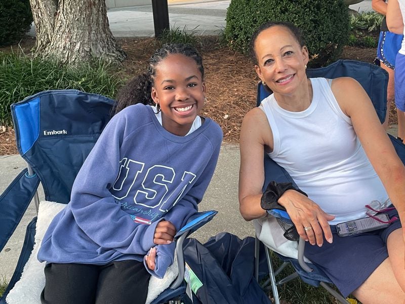 For grandmother and granddaughter duo Susan Peaselangford and Maria Reed, watching The Atlanta Journal-Constitution Peachtree Road Race is a tradition. (Photo: Anisah Muhammad
/AJC)