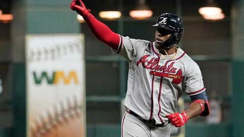 FILE - Atlanta Braves' Jorge Soler celebrates a three-run home run during the third inning in Game 6 of baseball's World Series between the Houston Astros and the Atlanta Braves Tuesday, Nov. 2, 2021, in Houston. The Braves would love to see him recreate that magic as they prepare for another postseason run by continuing to reunite members of that championship team. (AP Photo/Eric Gay, File)