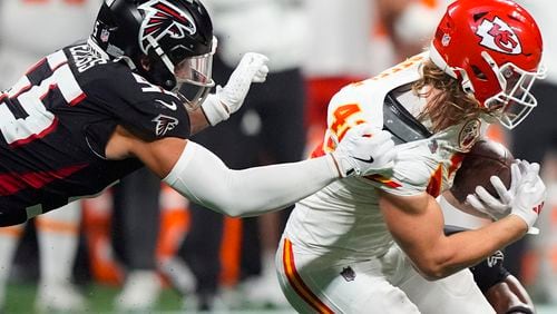 Atlanta Falcons linebacker Kaden Elliss (55) tackles Kansas City Chiefs running back Carson Steele (42) during the first half of an NFL football game, Sunday, Sept. 22, 2024, in Atlanta. (AP Photo/Brynn Anderson)