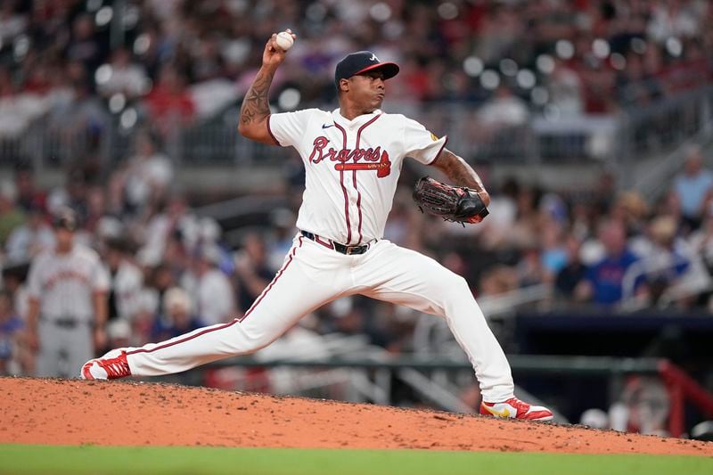 Atlanta Braves pitcher Raisel Iglesias (26) delivers in the ninth inning of a baseball game against the San Francisco Giants, Wednesday, July 3, 2024, in Atlanta. (AP Photo/Brynn Anderson)