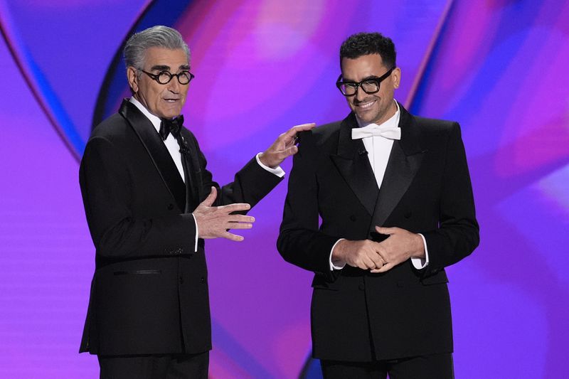 Hosts Eugene Levy, left, and Dan Levy speak during the 76th Primetime Emmy Awards on Sunday, Sept. 15, 2024, at the Peacock Theater in Los Angeles. (AP Photo/Chris Pizzello)