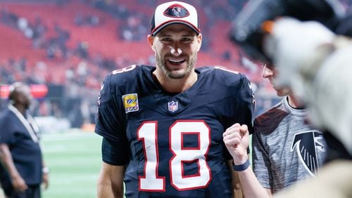 Atlanta Falcons quarterback Kirk Cousins (18)  smiles as he leaves the field after throwing the winning-game pass during overtime of an NFL football game against the Tampa Bay Buccaneers on Thursday, October 3, 2024, at Mercedes-Benz Stadium in Atlanta. Falcons won 36-30.
(Miguel Martinez/ AJC)