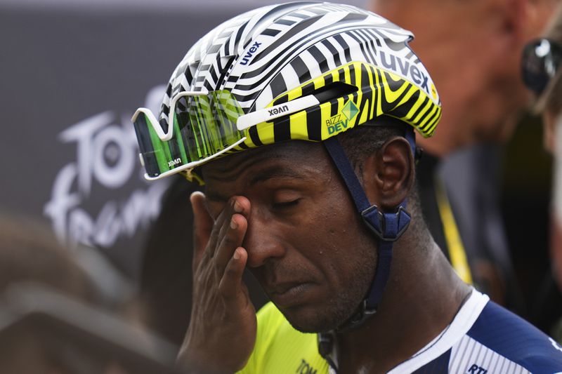 Stage winner Eritrea's Biniam Girmay reacts after the third stage of the Tour de France cycling race over 230.8 kilometers (143.4 miles) with start in Piacenza and finish in Turin, Italy, Monday, July 1, 2024. (AP Photo/Daniel Cole)