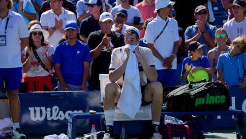 
                        John Isner, of the United States, reacts after losing to Michael Mmoh, of the United States, on the second day of the 2023 U.S. Open tennis tournament in New York, on Thursday, Aug. 31, 2023. (Amir Hamja/The New York Times)
                      