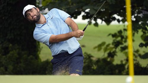 Scottie Scheffler hits onto a practice green at the St. Jude Championship golf tournament, Wednesday, Aug. 14, 2024, in Memphis, Tenn. The tournament is scheduled to begin Thursday. (AP Photo/Mark Humphrey)