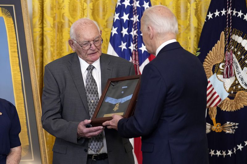 President Joe Biden presents the Medal of Honor to Gerald Taylor, the great great nephew of Pvt. Philip G. Shadrach, in the East Room at the White House in Washington, Wednesday, July 3, 2024. The medals posthumously honor two U.S. Army privates who were part of a daring Union Army contingent that stole a Confederate train during the Civil War. U.S. Army Pvts. Philip G. Shadrach and George D. Wilson were captured by Confederates and executed by hanging. (AP Photo/Susan Walsh)