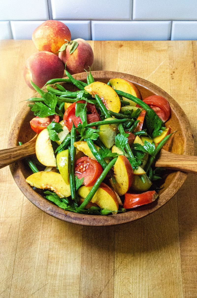 Green Beans, Peaches and Tomato Salad is far from your average salad. Crisp, tender French green beans with heirloom tomatoes and sliced peaches are dressed with extra-virgin olive oil and sherry wine vinegar. (Virginia Willis for The Atlanta Journal-Constitution)