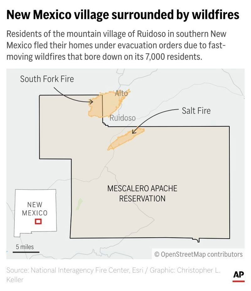 Residents of Ruidoso in southern New Mexico fled their homes under evacuation orders due to fast-moving wildfires that bore down on the mountain village's 7,000 residents. (AP Digital Embed)