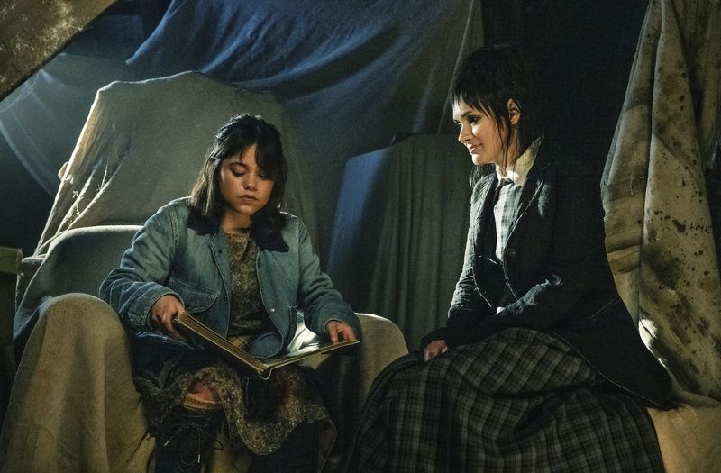 This image released by Warner Bros. Pictures shows Jenna Ortega, left, and Winona Ryder in a scene from "Beetlejuice Beetlejuice." (Parisa Taghizadeh/Warner Bros. Pictures via AP)